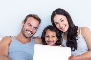 Happy family in their bedroom