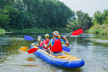 Family kayaking on the river