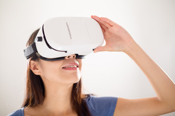Asian Woman wearing virtual reality device