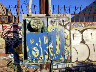 Urban ghetto electrical box with colorful painted graffiti - landscape color photo