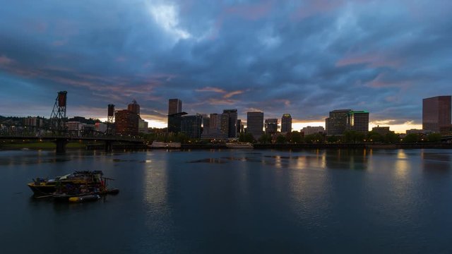 Time lapse of clouds and sky over downtown Portland Oregon from sunset into blue hour evening along Willamette River 4k uhd