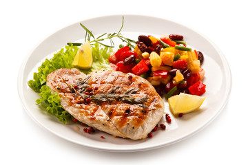 Grilled steak and vegetables on white background 