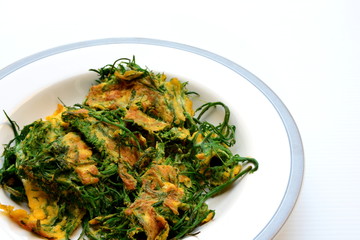 Cha-om Omelet in white plate(Acacia Pennata Omelet); Thai traditional food