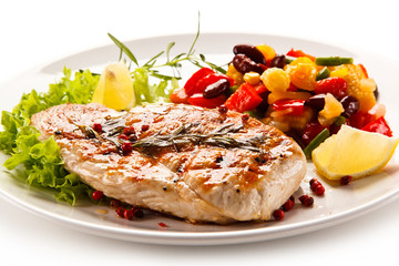 Grilled steak and vegetables on white background 