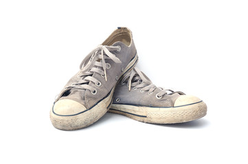 Old sneakers on white background, Old and dirty canvas sneakers