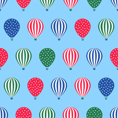 Hot air balloon seamless pattern. Baby shower vector illustration on blue sky background. Polka dots and stripes. Colorful hot air balloons design.