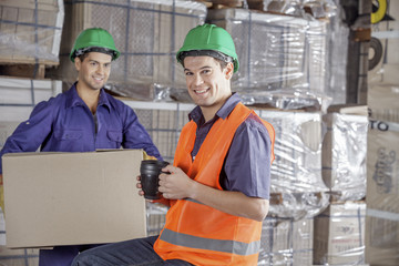 Workers In Warehouse Preparing Goods For shipping