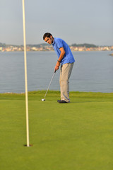 Young man playing golf