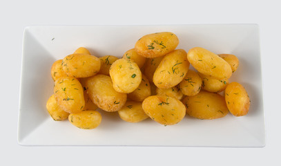 Dish with boiled and fried potatoes with dill.