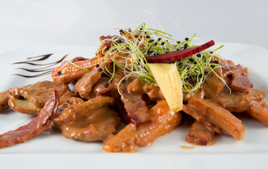 Beef stew, roast with sauce and sprouts.