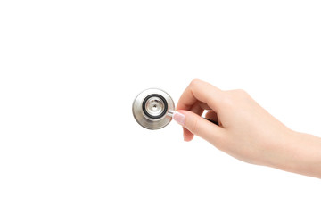 Female hand holds stethoscope on a white background.