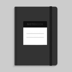 Moleskin notebook with black elastic band image.