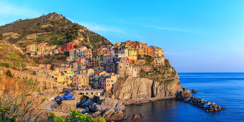 Fototapeta na wymiar Sunset in Manarola.Manarola is a small town, in the province of La Spezia, Liguria, northern Italy. It is the second smallest of the famous Cinque Terre towns frequented by tourists.