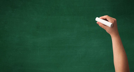 Hand writing on clean blackboard