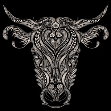 Abstract vector head of cow on a black background