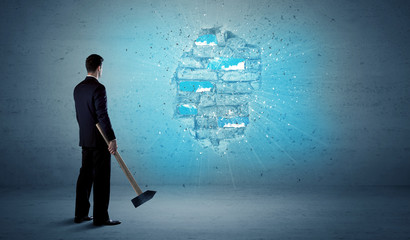 Business man hitting brick wall with huge hammer © ra2 studio