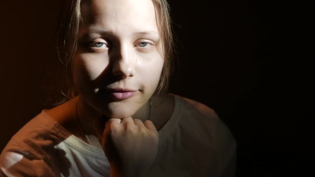 Portrait of a pensive smiling teen girl 4K UHD