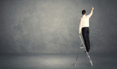 businessman drawing on grunge wall