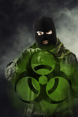 Man threatening with bioterror biohazard symbol