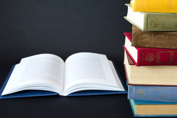 Stack of books on black background