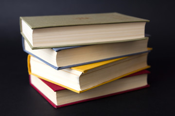 Stack of books on black background