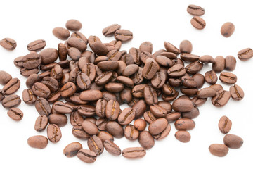 Coffee grains and leaves isolated on the white backgrounds.