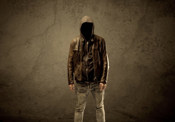 Fototapeta na wymiar Undercover hooded stranger in the dark
