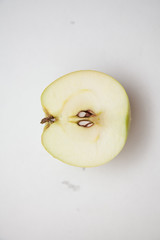 Green apple fruits and half of apples isolated on white background