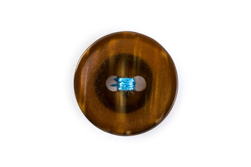 button with blue thread on white background