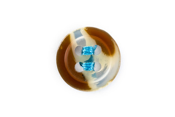 button with blue thread on white background
