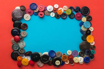 button and blue sheet of paper on a red background