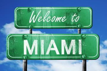 miami vintage green road sign with blue sky background