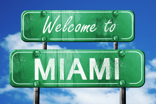 Miami Vintage Green Road Sign With Blue Sky Background