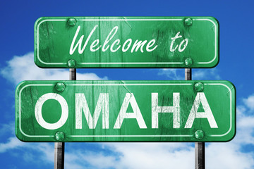 omaha vintage green road sign with blue sky background