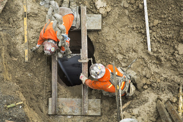 Caucasian workers building at construction site