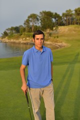 Young man playing golf