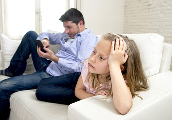 internet addict father using mobile phone ignoring little sad daughter bored lonely and depressed