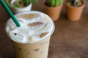 Glass Of Cold Coffee On Wood Table