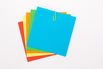 colored sheets with a yellow paper clip