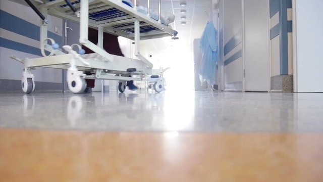 Patient Transportation in Hospital on Surgical Bed
