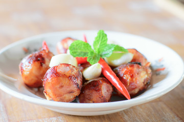 Grilled sausages on dish