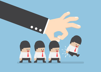 Giant hand flick businessman away