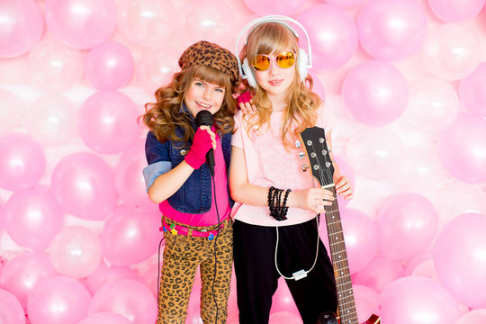 two little girl with a microphone