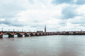 Fototapeta premium Bordeaux river bridge with St Michel cathedral, France