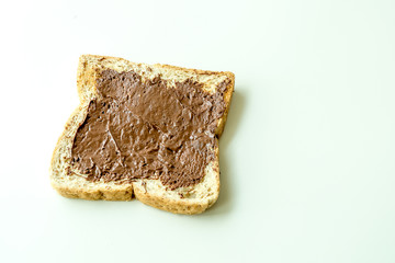 Bread with chocolate cream isolated on white background