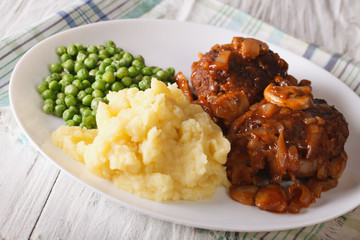 Simple Food: Salisbury steak with mashed potatoes and green peas 
