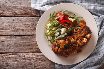 Salisbury steak with mushroom sauce and vegetable. horizontal top view 
