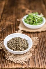 Dried Thyme on wooden background