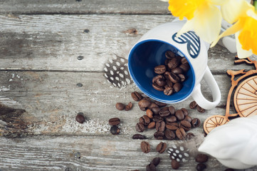 Background with emty blue coffee cup and beans