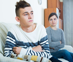 Frustrated  mother and angry teen quarrelling  in domestic inter